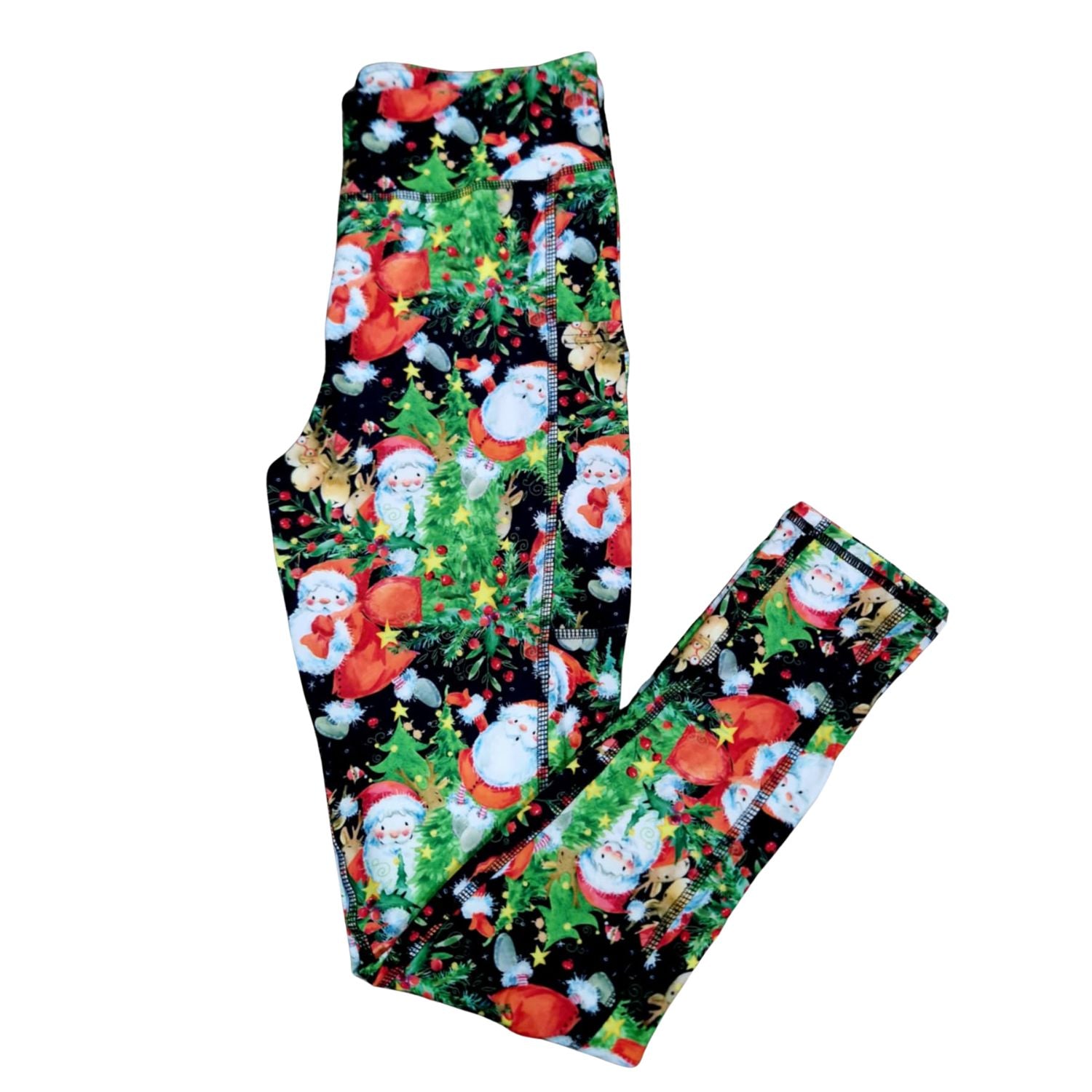 Leggings with Christmas-themed design featuring Santa Claus and trees on a black background.